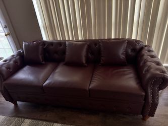 New Elegant 3 seater sofa with three cushions.