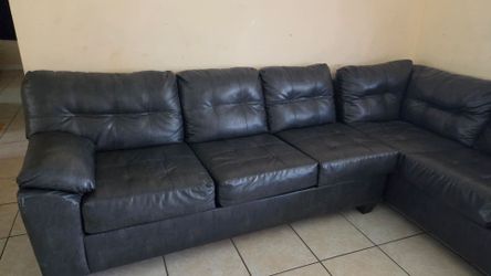 Dark gray L shaped couch. Very comfy