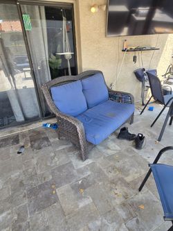 Outdoor Wicker Loveseat with Blue Cushions