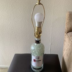 Empty  Kettle One Bottle Lamp  inside the bottle is filled with clear marbles very cool