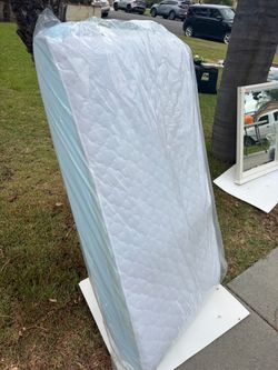 White Quilted Mattress Still in Plastic