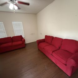RED COUCH AND LOVE SEAT WITH PULL OUT BED