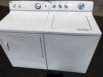 LIKE NEW - Mega Capacity - GE Top Load Washer and Gas dryer set in white