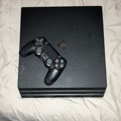 playstation  4 pro and  2 controllers