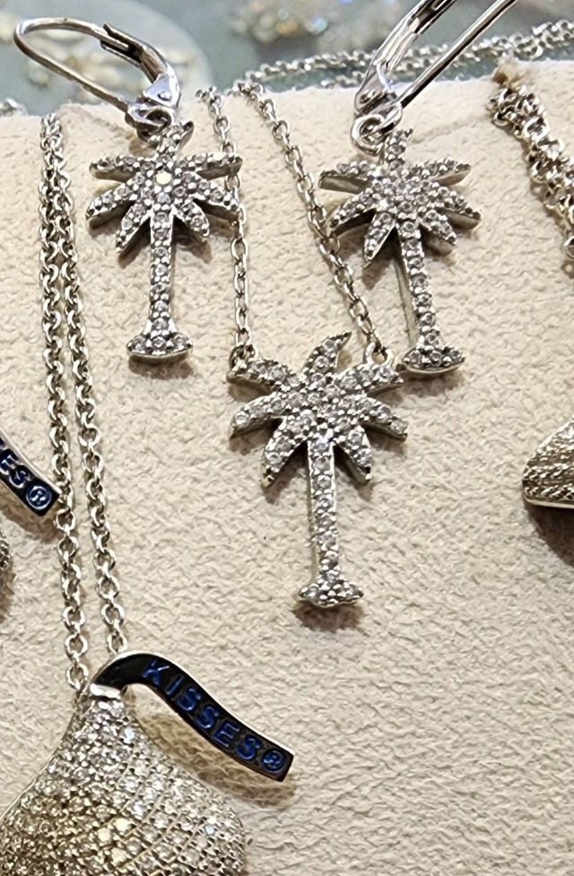 Palm tree necklace and earring set made with cubic zirconia and rhodium finish