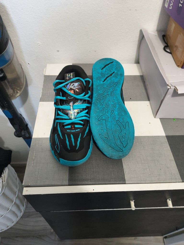 Puma LaMelo Ball Basketball Shoes, Black And Blue Colorway.