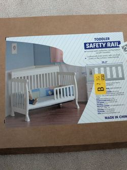 Toddler crib safety rail