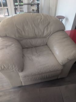 Large leather arm chair with ottoman