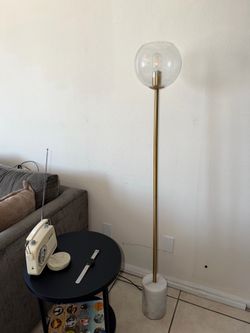 Brass floor lamp with marble base