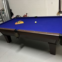 Pool Table And Pool Sticks 