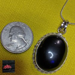 BLACK ONYX PENDANT ON A STERLING 18" STERLING CHAIN.