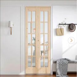 30 in. x 80 in. Pre Assembled Clear Glass Solid Core Wood Spruce Bi-fold Door with Hardware