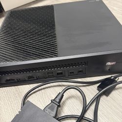 Black Xbox One S console. Includes power supply and cables. Clean, minimalist design. Ready to display or use.