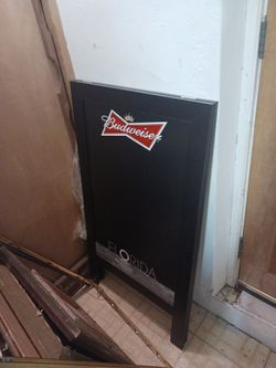 The image shows a Budweiser chalkboard sign for the state of Florida. Additional information:
Budweiser is an American-style lager introduced in 1876.