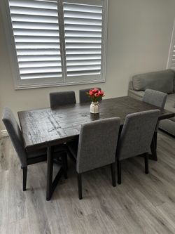 Rustic wooden table with 6 chairs