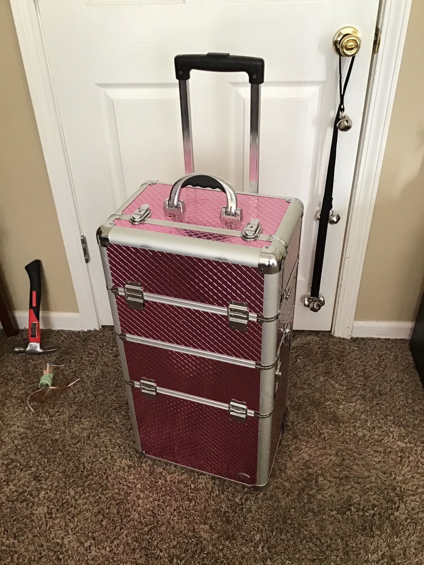 Beautiful pink metal makeup suit case with many compartments