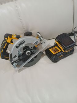 DEWALT  XR  7-1/4" BRUSHLESS CIRCULAR SAW WITH  BATTERY  AND 6AMP. CHARGER..BRAND NEW ,,, $250..
