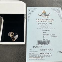 Rare 925 sterling silver rhinestones zultanite gemstone ring size 7.5  In great condition  Comes with COA Zultanite is a natural gemstone that changes