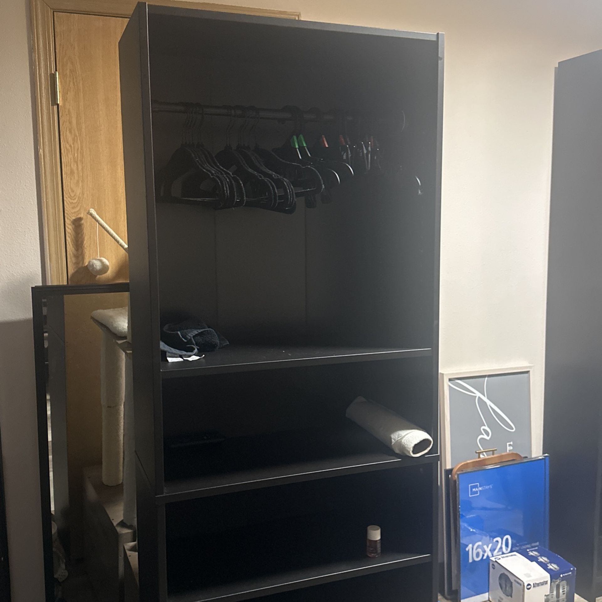 Black Bookshelf With Closet Bar Attached