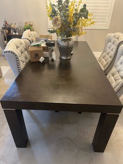 I'm looking at this black table—without the chairs—in excellent condition.