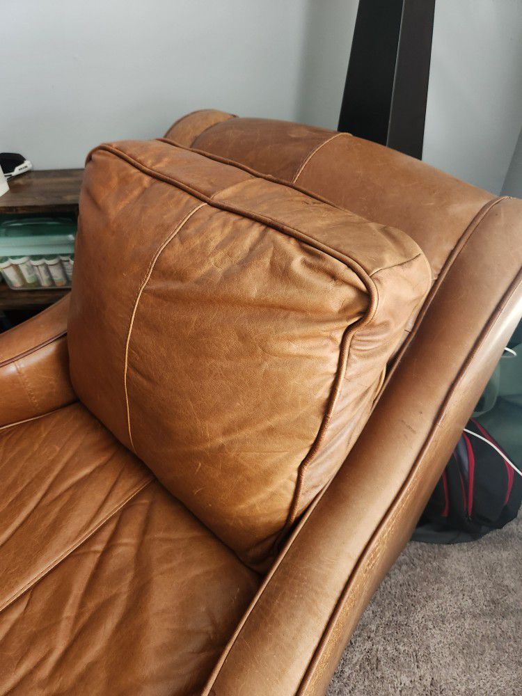 Vintage Leather armchair and Ottoman