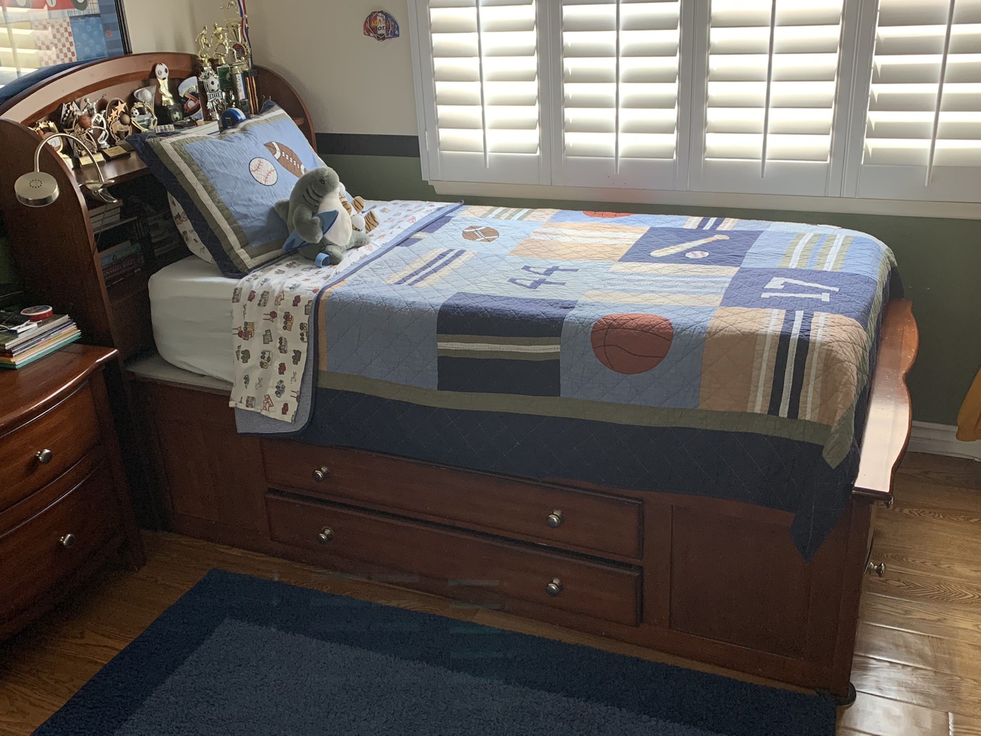 Platform twin bed, with drawers and headboard.
