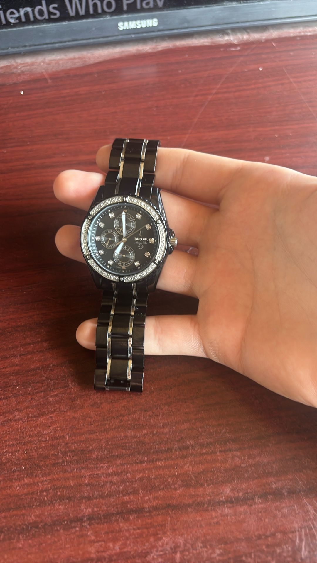 Bulova Watch black band with real Diamonds behind the crystal watch face and crystals around the dial