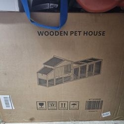 Wooden Pet House, new in its original box.