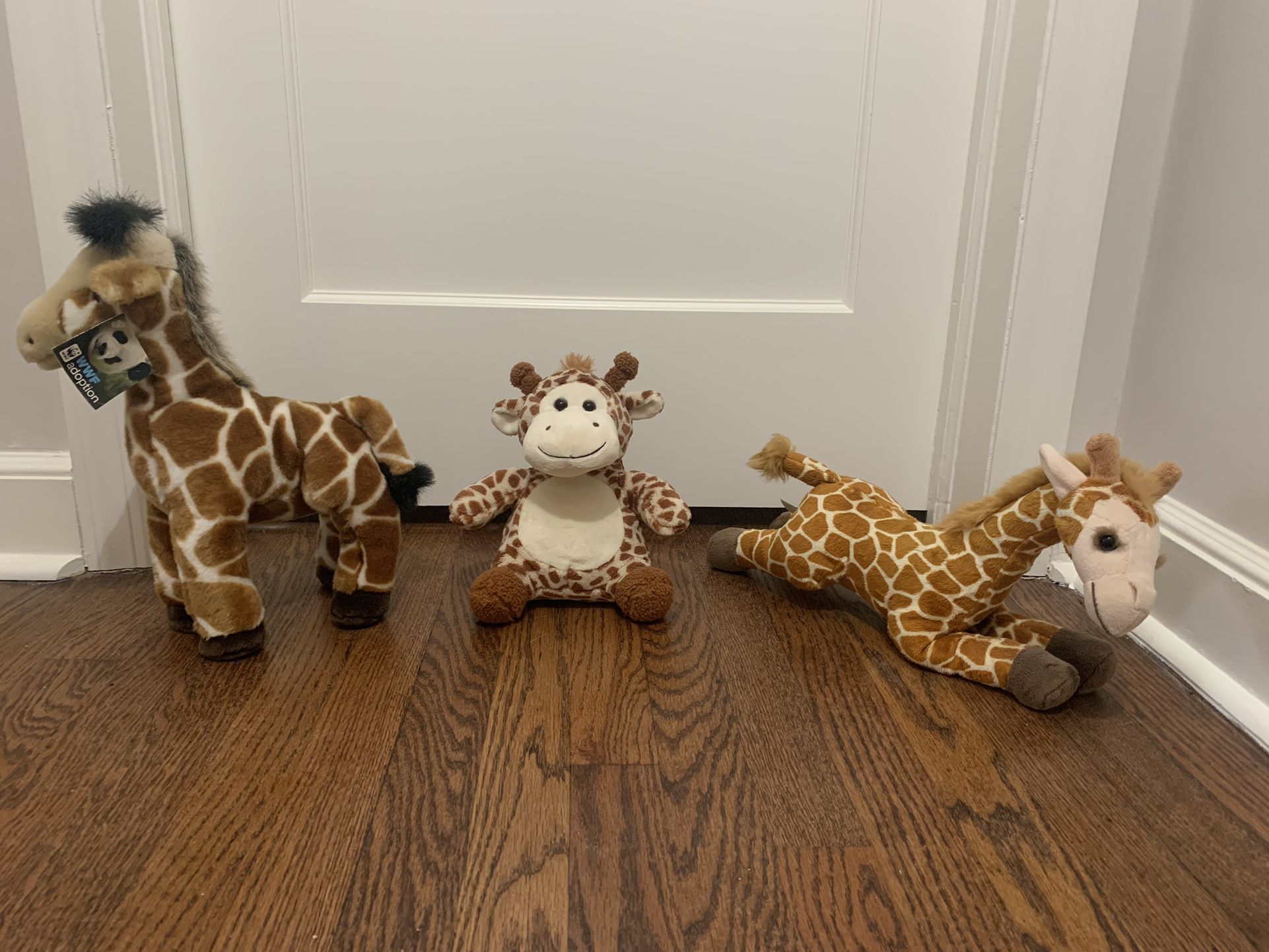 Three Giraffe Stuffed Animals 