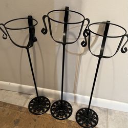 THREE WROUGHT IRON PLANT STANDS