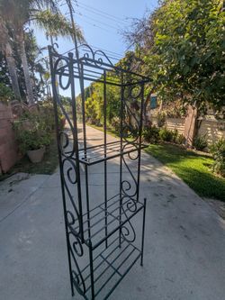 Wrought iron garden shelf.