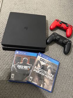 SONY PLAY STATION 4 WITH TWO CONTROLLERS AND TWO GAMES