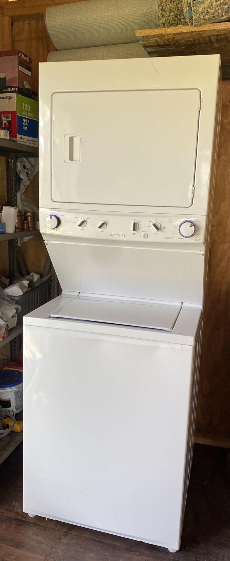 White Electric Washer and Dryer laundry unit 