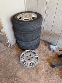 Set of 4 factory wheels with tires.