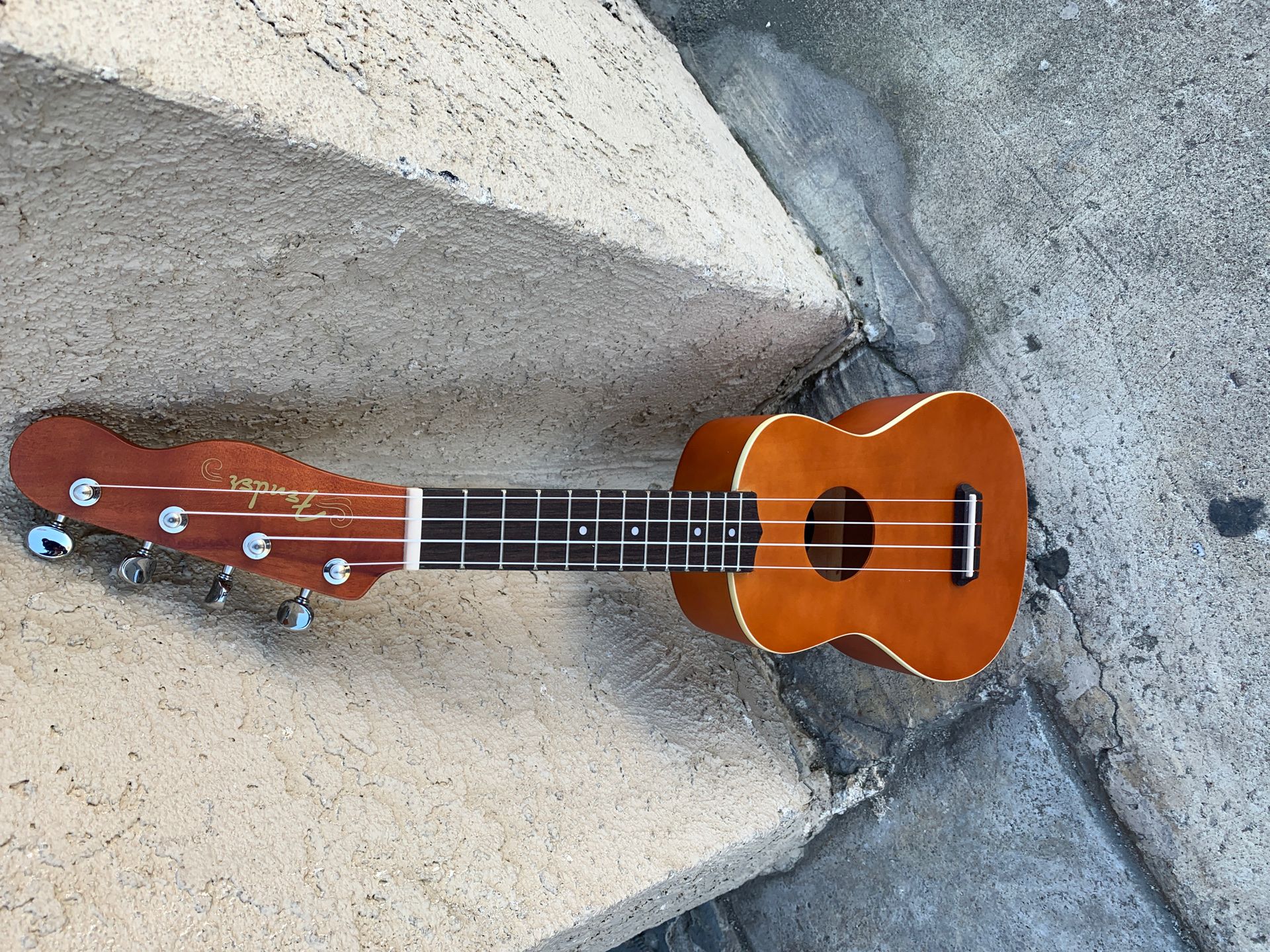 Small ukulele guitar