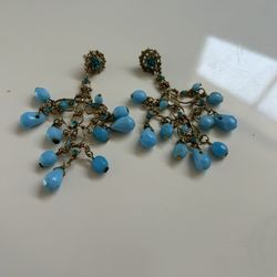 A statement earring. Turquoise glass beads and gold chandelier costume jewelry earrings