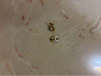 Gold bee hoop earrings with blue stones