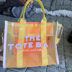 Marc Jacobs The Mesh Tote Bag in yellow and multicolor mesh material.