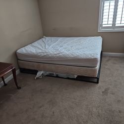 Queen Bed, Boxspring And Metal Frame, 2 Small Tables And A Folded Wooden Tray And A 65" TCL TV With HMDI Ports 