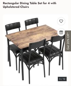 Small dining table with 4 chairs. Kids only sat and ate at this table due to it being smaller than expected.