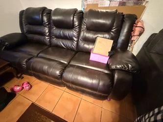 Black leather recliner sofa