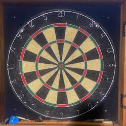 Dart board with wooden cabinet