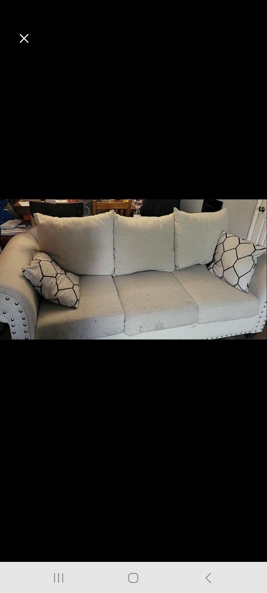 Free Beige Sofa with Cushions and Coffee Table