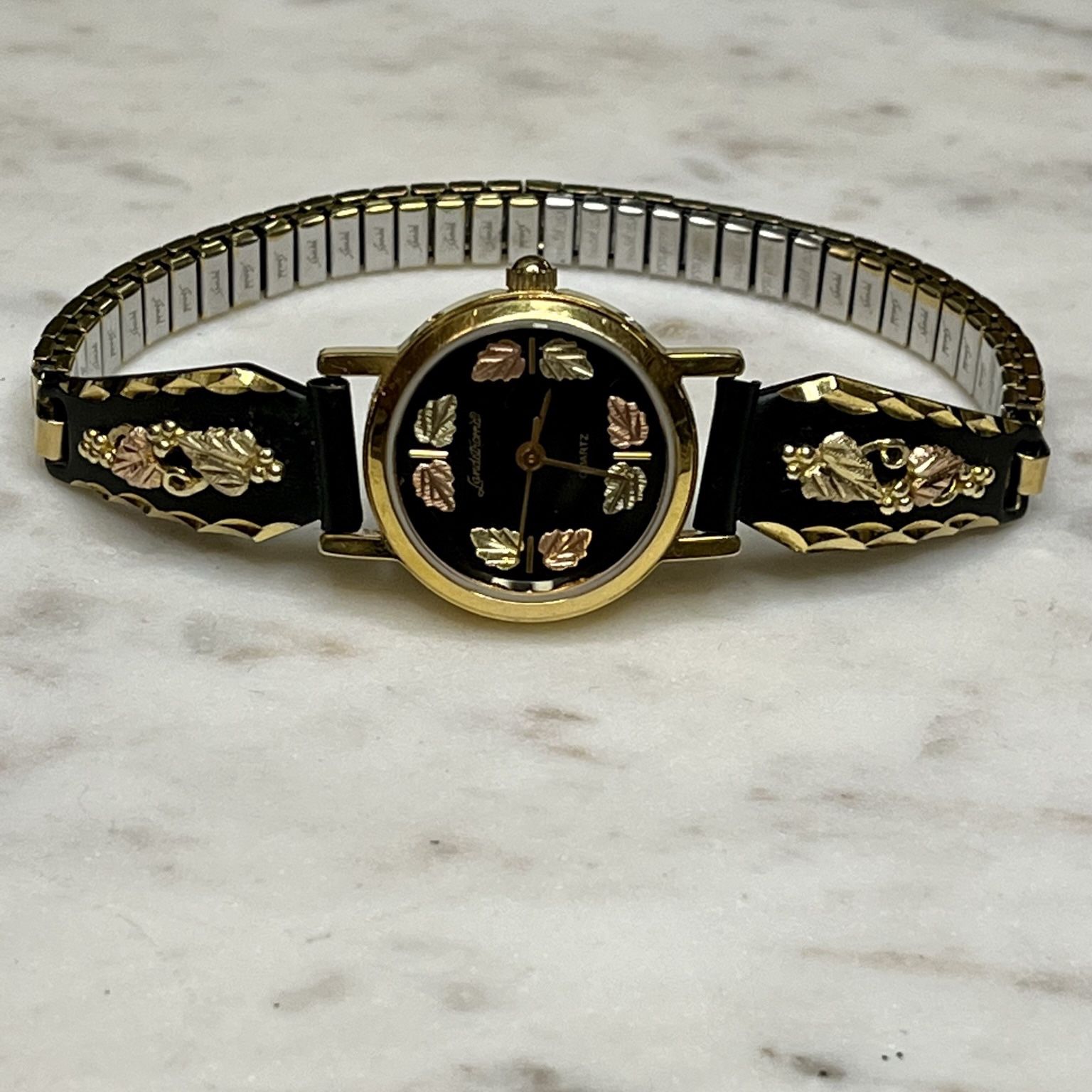 Vintage black 2024 hills gold watch
