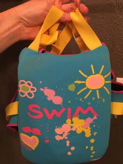 Swim vest, armbands, and diapers