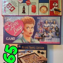 3 Board Games Coca-Cola Monopoly , I Love Lucy game and Scrabble Deluxe Travel Edition  $65
