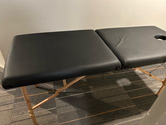 Black leather massage table