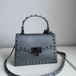 Rockstud Spike Silver Crossbody Rubber Handbag. Removable Strap. Water Resistant Material. New, Never Used.