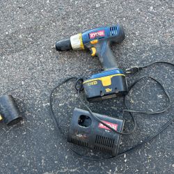 Ryobi Cordless Drill And Charging Unit With Battery