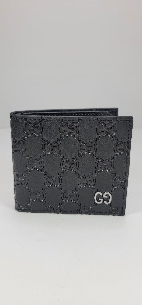 GUCCI SIGNATURE LOGO BI-FOLD WALLET.